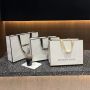 Custom white shopping paper bag with black ribbon